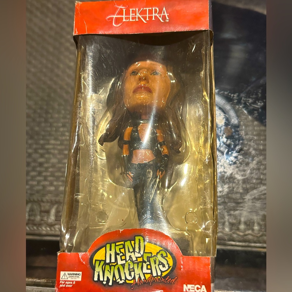 Elektra™️ Head Knocker’s™️ Bobble Head Figure